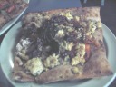 I think this out of focus picture is of the "Portobello Redhead: seared
portobellos topped with a red roasted pepper almond sauce, browned
onions, and feta."  Artificially brightened.
